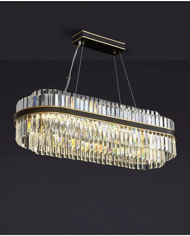 Elegant oval luxury led crystal chandelier with clear crystal prisms and gold-toned metal accents for home decor