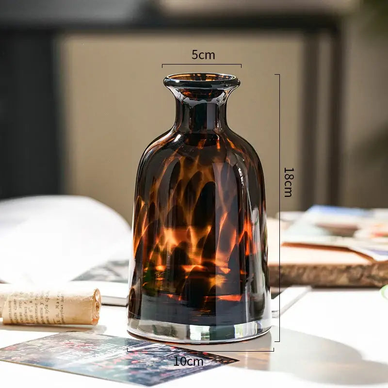 DecorBites luxury leopard glass vase in sleek amber with tortoiseshell pattern and reflective silver base for home decor