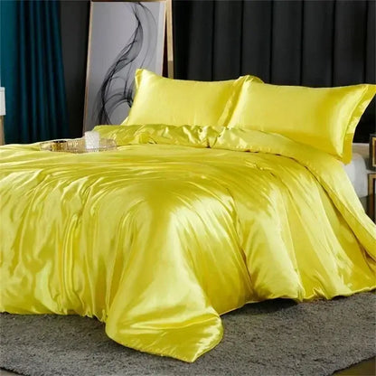 Vibrant yellow satin duvet cover with matching pillows in a decorbites luxury mulberry silk bedding set queen king size