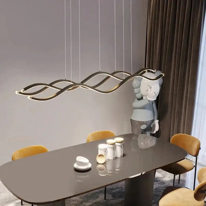 Modern gold-toned wave-shaped led pendant light with sleek curves for dining room luxury nordic chandeliers by decorbites