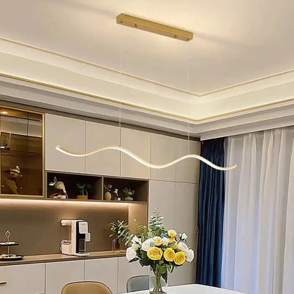 A sleek luxury nordic chandelier with smooth curved design and warm white led for dining room lighting