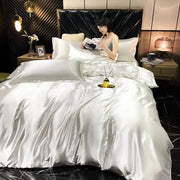 Shiny silver satin DecorBites luxury rayon silk bedding set king size with pcs duvet cover and matching pillows on plush headboard