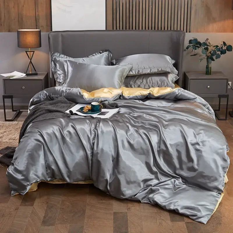 Luxurious solid color silver satin pcduvet cover set with gold inner lining and matching pillows for width bed sizes
