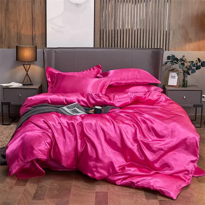 Vibrant fuchsia solid color decorbites luxury satin bedding set with matching pillows and plush duvet for width bed