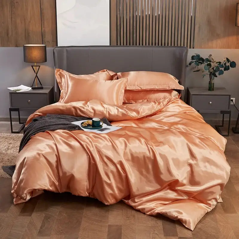 Decorbites™ luxury solid color satin pcduvet cover set in glossy peach with matching pillowcases and dark gray throw blanket