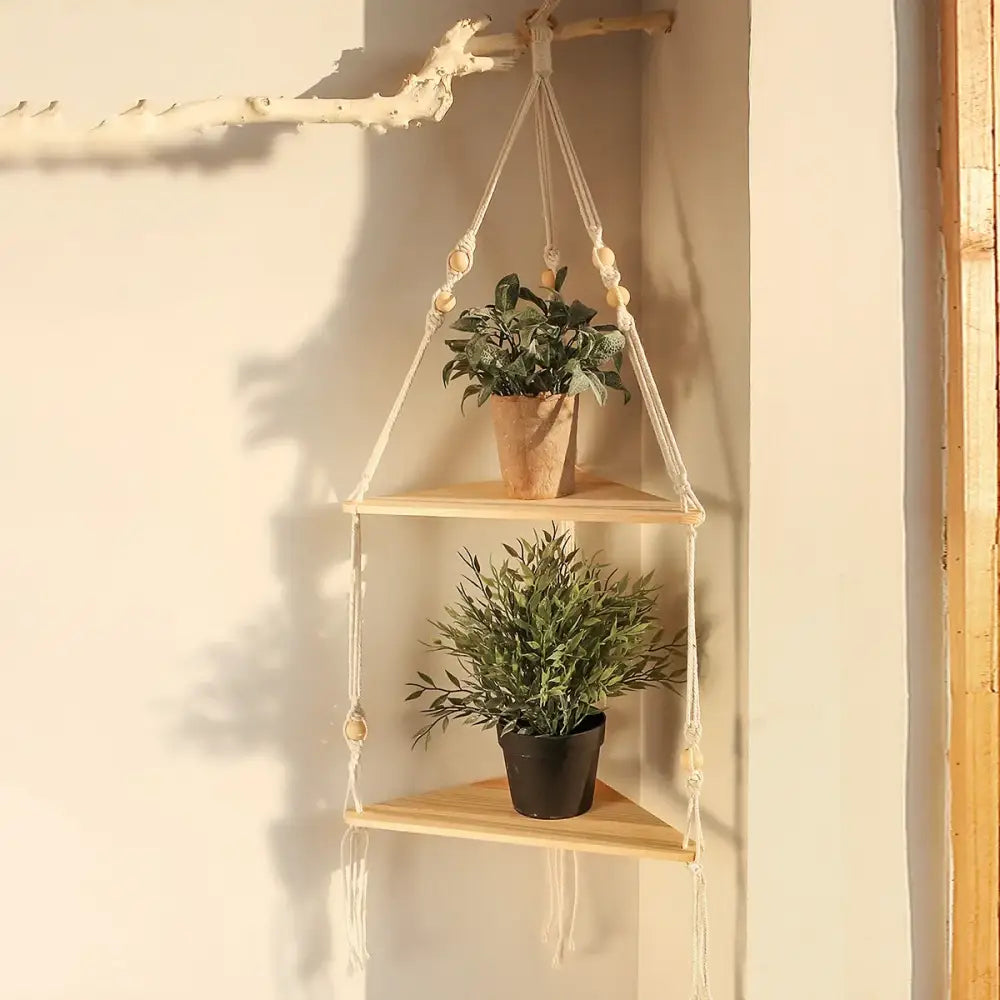 Beige macrame wall hanging corner shelf with wooden triangular tiers and beaded accents for boho decor