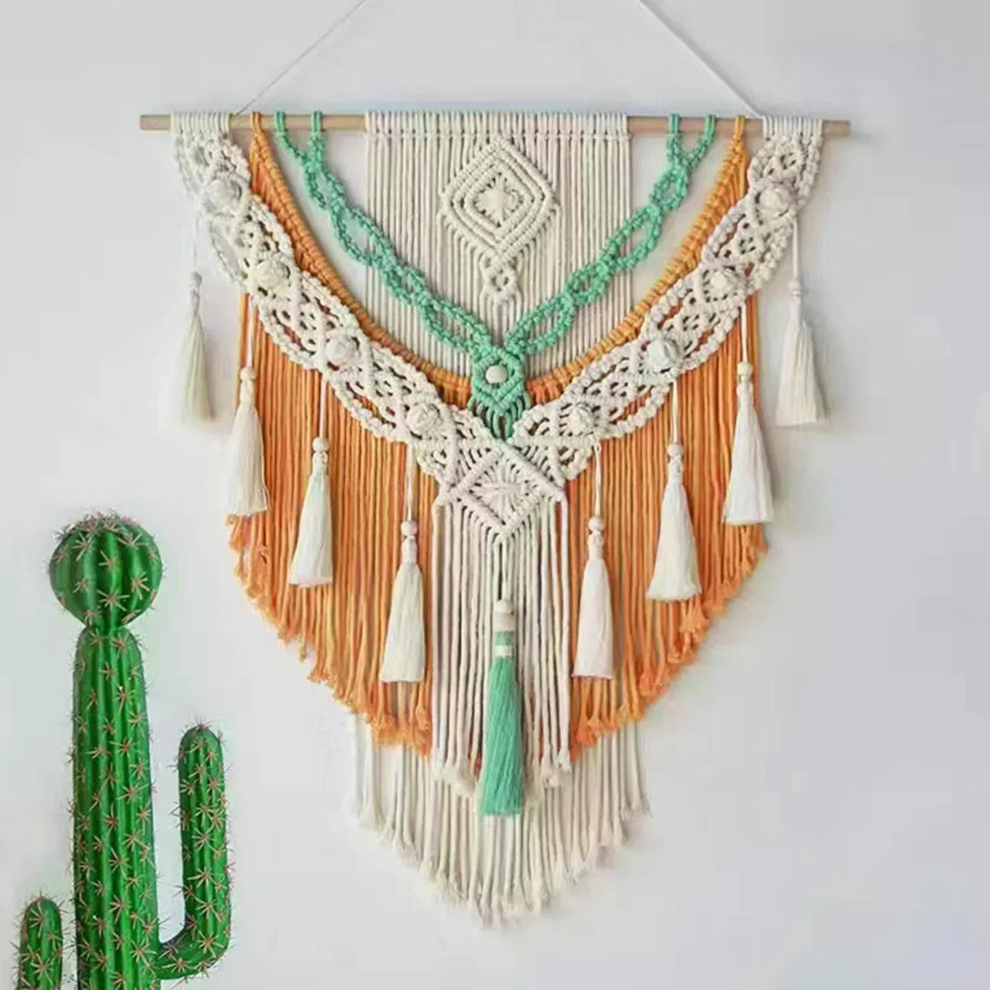 Decorbites™ chic bohemian macrame wall hanging with intricate white mint green and orange woven patterns and tassels