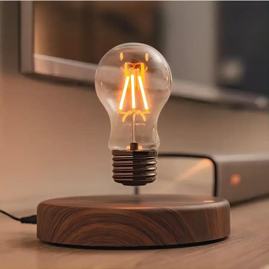 A decorbites magnetic levitation lamp featuring a floating vintage-style incandescent bulb with warm filaments on a dark wood base