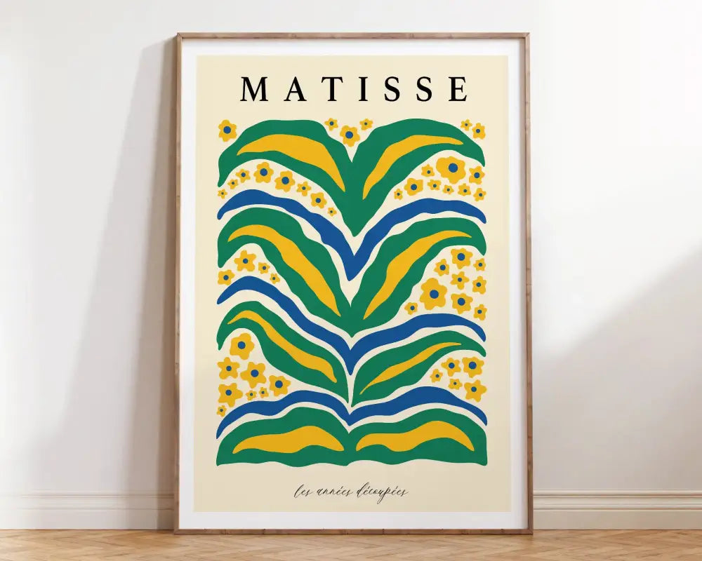 A framed decorbites™ matisse floral art print with bold green yellow and blue abstract floral patterns and matisse text