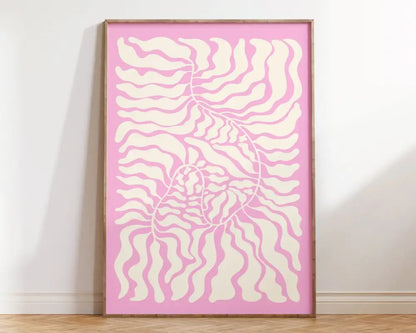 A framed DecorBites™ matisse floral art print with flowing cream patterns on a soft pink background for wall decor
