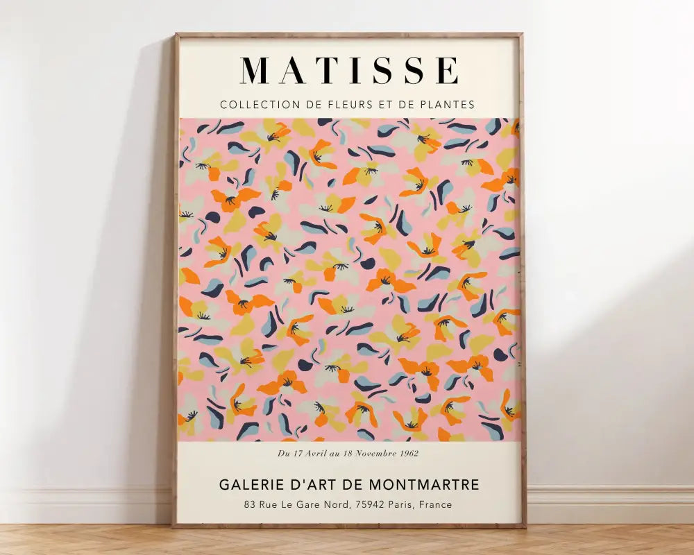 A framed DecorBites™ canvas with matisse floral art print featuring vibrant orange yellow and blue flowers on pink