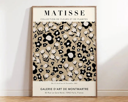 A framed beige canvas featuring black and white matisse floral art prints with exhibition text for DecorBites™
