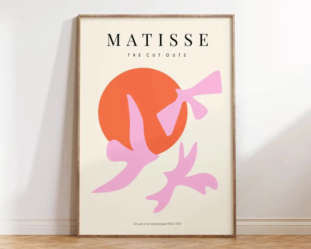 A framed decorbites™ matisse floral art print featuring bold pink bird silhouettes on an orange circle background