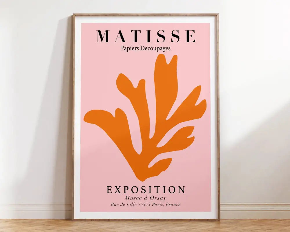 A framed decorbites™ matisse floral art print featuring an orange botanical cut seaweed design with black exhibition paintings text