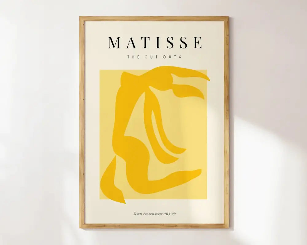 Minimalist decorbites™ matisse floral art print with bold yellow abstract figure in light wood frame, botanical cut style exhibition paintings