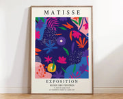 A vibrant framed decorbites™ matisse floral art print featuring bold pink orange blue and purple flower market patterns on navy background