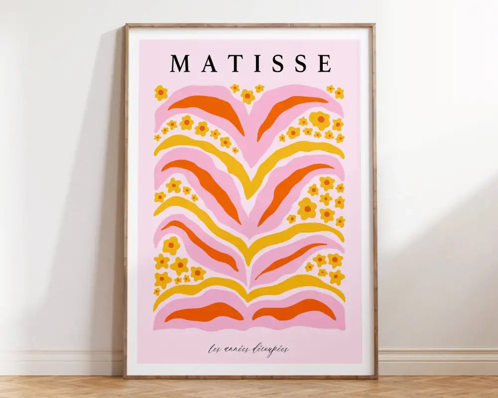 A framed decorbites™ matisse floral canvas print with bold pink orange and yellow stylized floral patterns on soft pink background