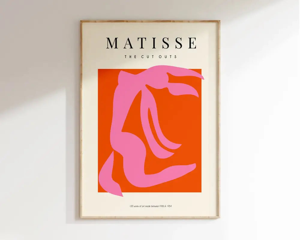 A framed art print of matisse floral featuring a bold pink silhouette on orange abstract flowers canvas by decorbites