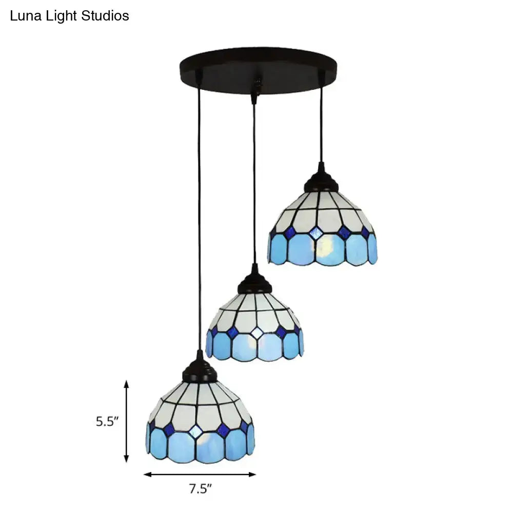 Set of three mediterranean cut glass bowl hanging light fixtures with blue geometric patterns and dark bronze mount