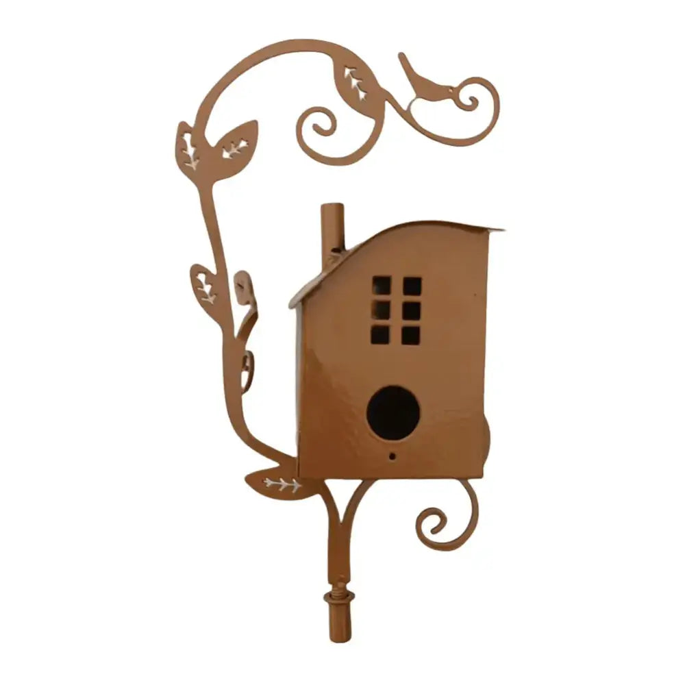 Brown metal birdhouse garden stake with ornate vine design, chimney, window cutout, and circular entrance hole for outdoor decor