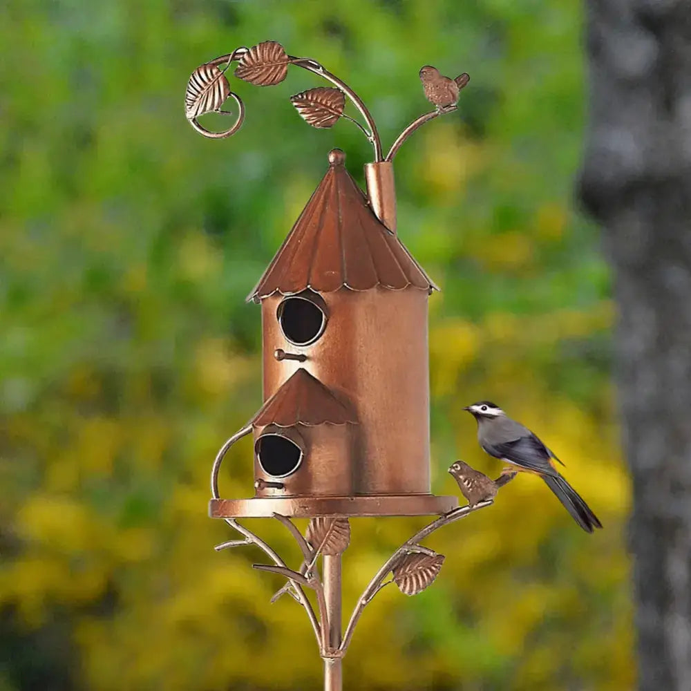 Copper-colored metal birdhouse garden stakes with two nesting compartments and decorative leafy branches by DecorBites™
