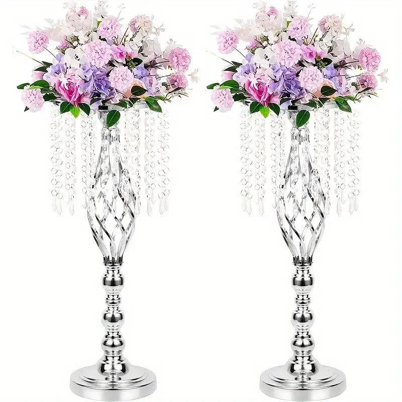 Two elegant silver metal flower vases with twisted design and artificial pink purple white flowers for wedding centerpieces