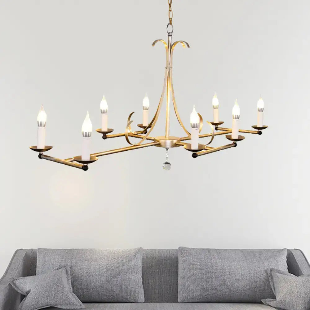 Antique brass metal island chandelier with nine traditional candle bulbs and dangling crystal accent in gold and silver