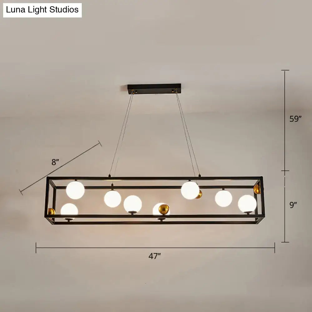 DecorBites metal pendant light with black metal frame, milk glass shade globes, and gold accents for industrial dining rooms