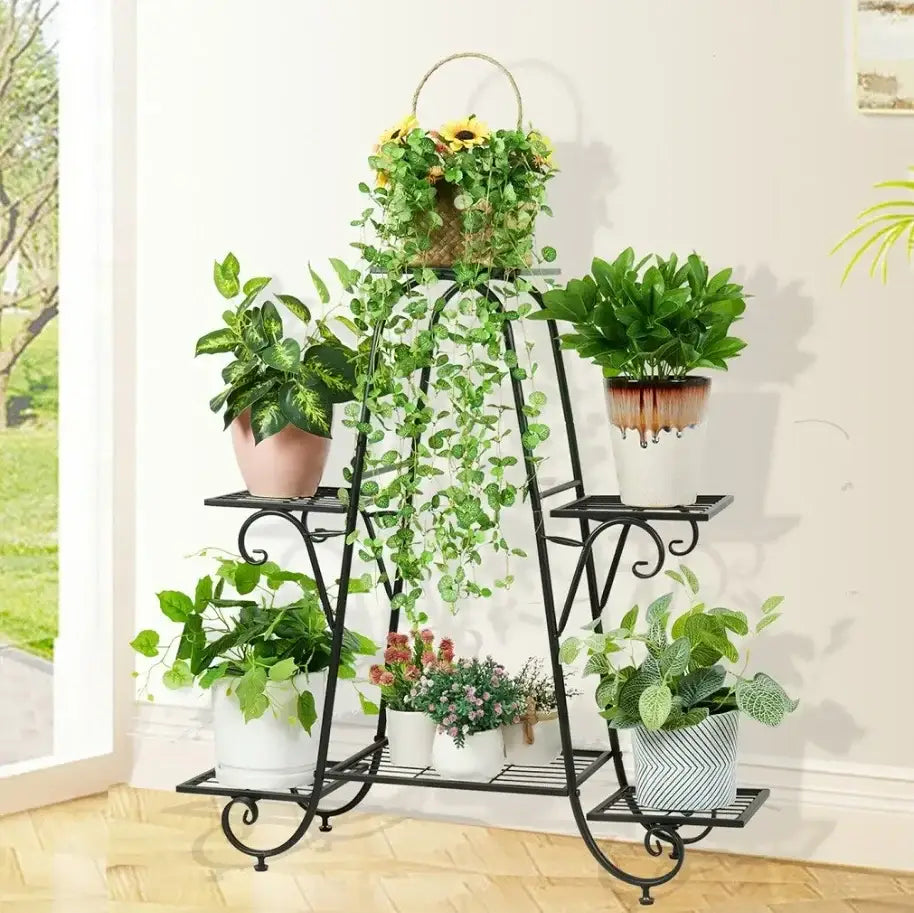 Black wrought iron 6 tier metal plant stand with ornate scrollwork for displaying various potted plants DecorBites™