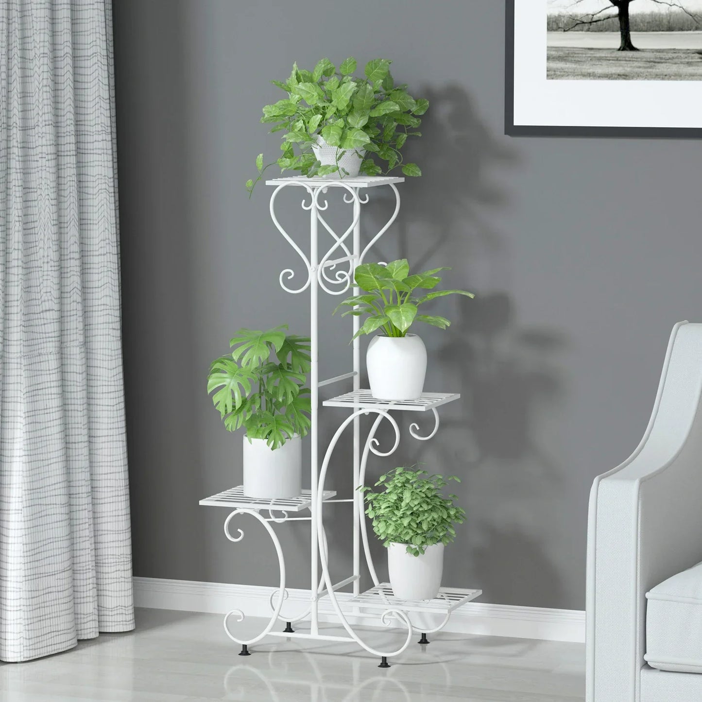 White wrought iron metal plant stand with ornate scrollwork and four tiers for holding four flower pots by DecorBites