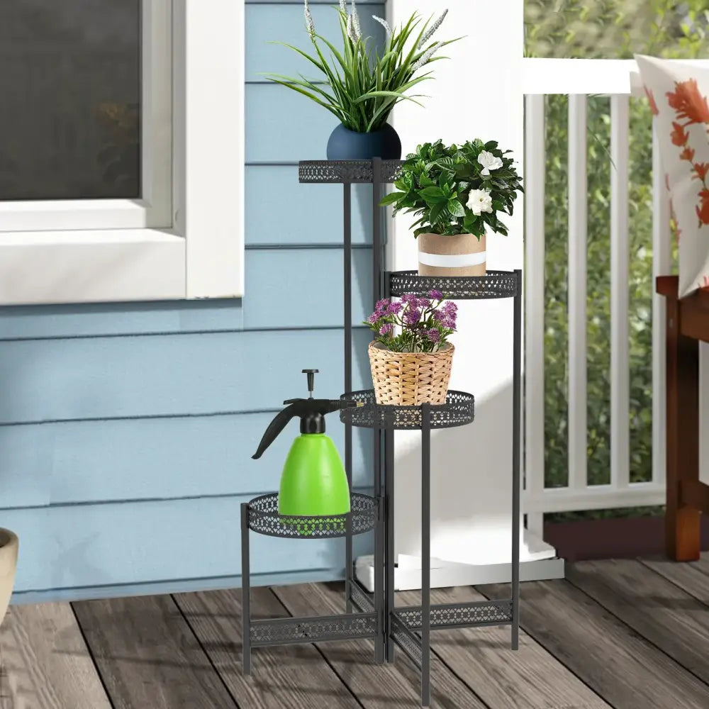 Black metal tiered plant stand with circular perforated shelves for indoor and outdoor living room use by DecorBites
