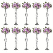Silver metallic metal vase set with intricate twisted designs holding artificial lavender and white roses by decorbites