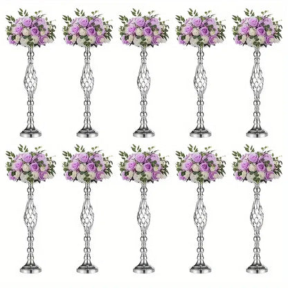 Silver metallic metal vase set with intricate twisted designs holding artificial lavender and white roses by decorbites