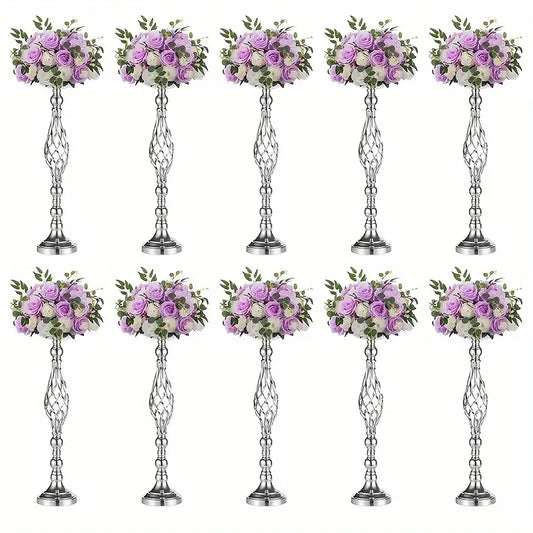 Silver metallic metal vase set with intricate twisted designs holding artificial lavender and white roses by decorbites