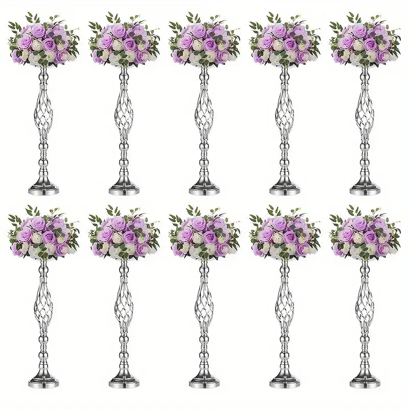 Silver metallic metal vase set with intricate twisted designs holding artificial lavender and white roses by decorbites