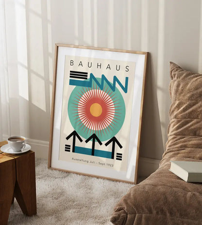 A framed bauhaus poster featuring bold blue teal and orange in a mid century geometric canvas art design