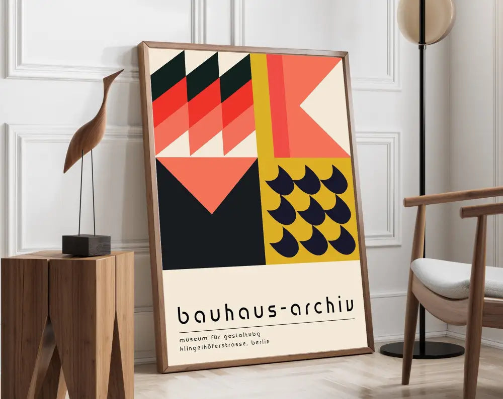 A framed DecorBites™ mid century geometric canvas wall art with bold red black yellow and cream patterns