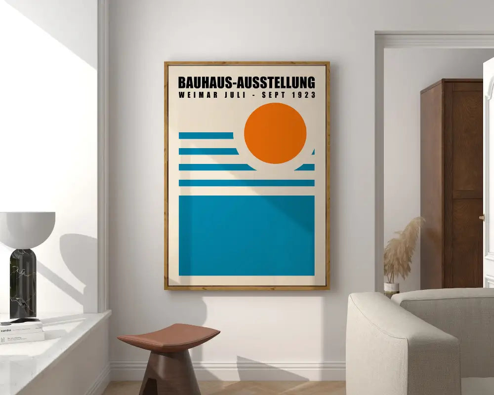 A framed bauhaus poster canvas with bold orange and teal geometric wall art mounted on a white wall for mid century decor