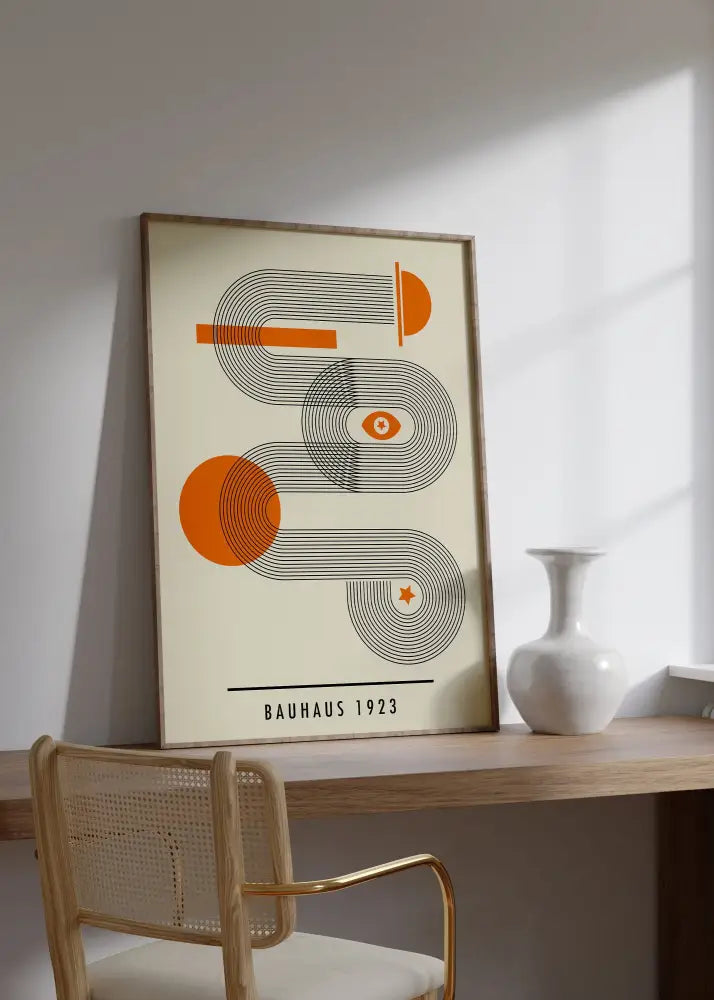 Decorbites mid century bauhaus poster canvas with orange and black geometric wall art in a light wood frame