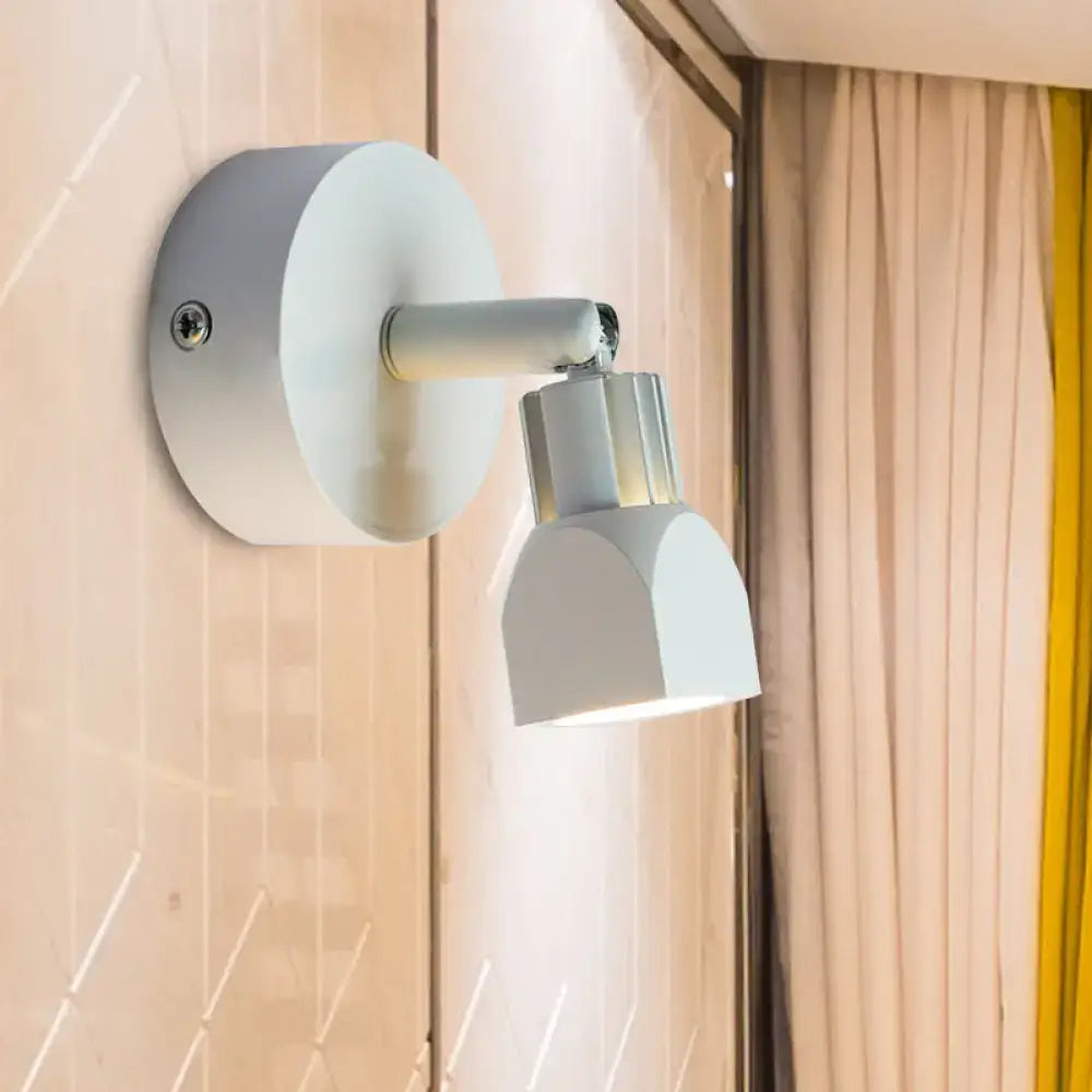 Contemporary style black and white wall lamp with direct wired electric led spotlight and metallic accents for bedroom use