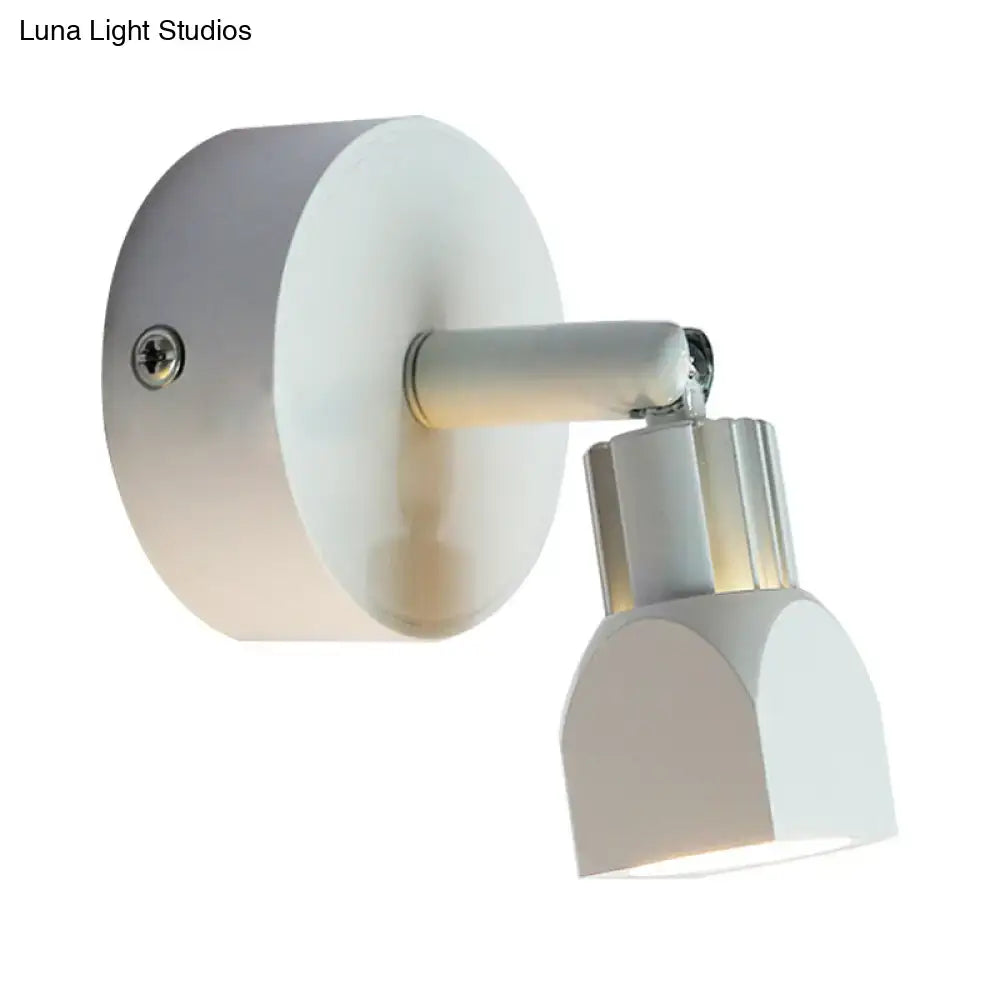 Contemporary style white wall lamp with matte circular base and adjustable arm for direct wired electric bedroom spotlight