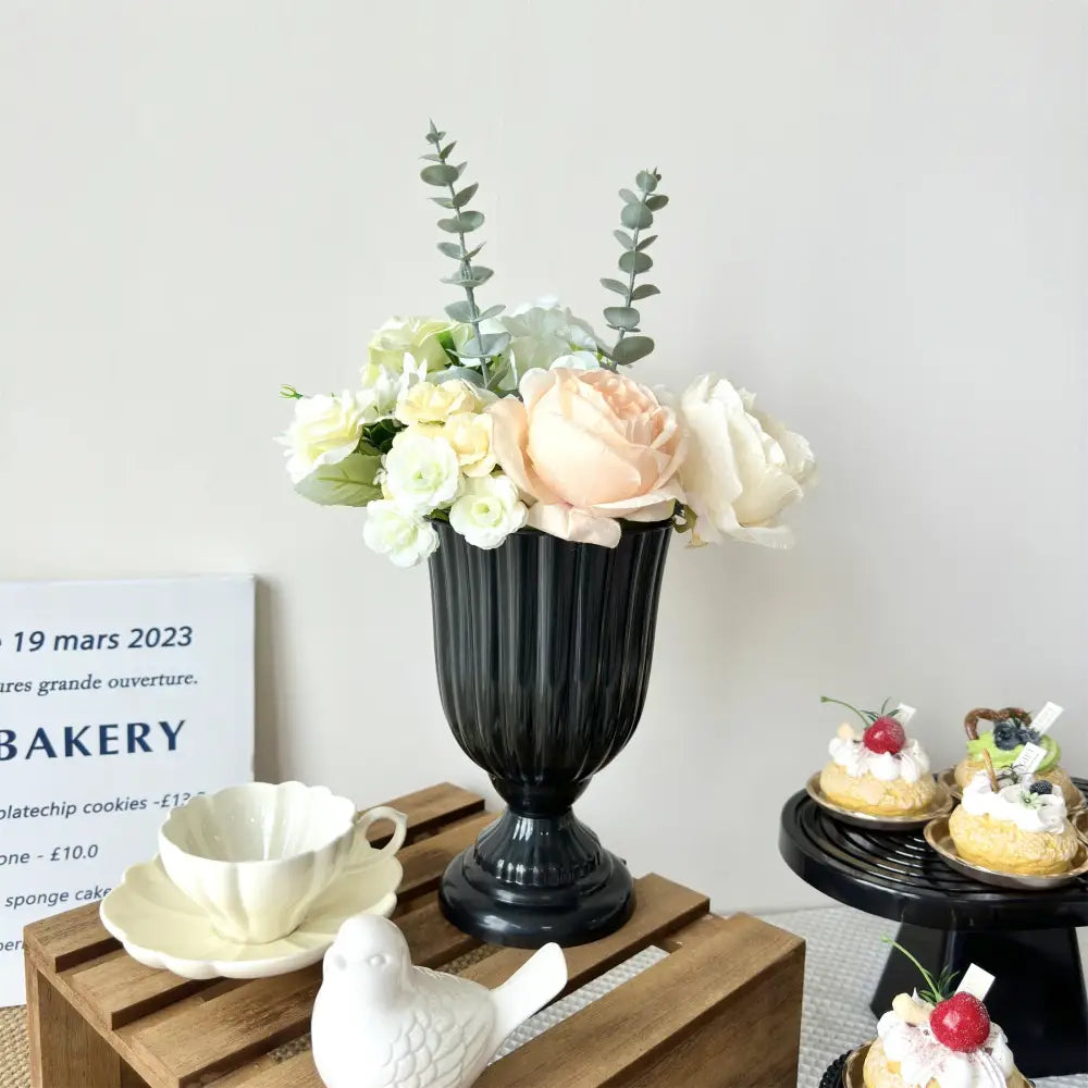 Elegant black ribbed ceramic DecorBites™ mini flower arrangement vase with peach cream roses and eucalyptus accents