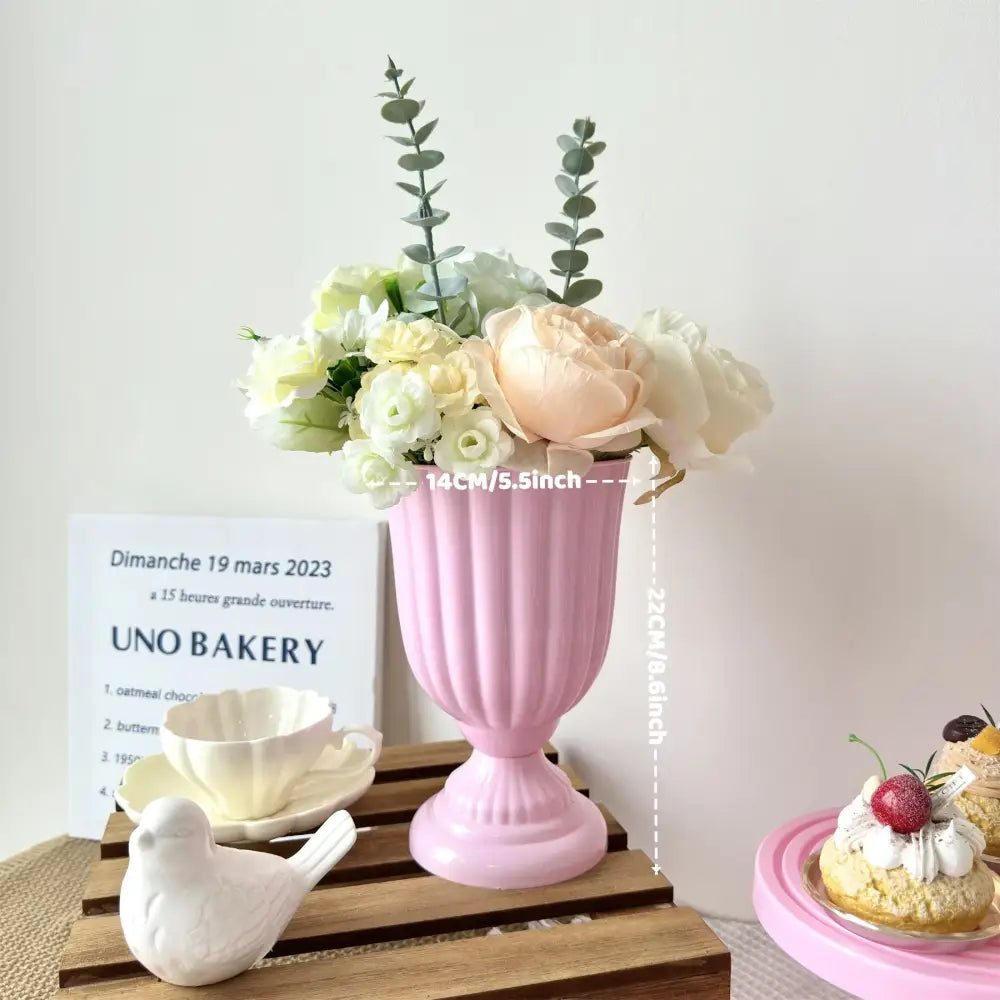 Pink ribbed ceramic mini flower arrangement vase with fluted design and pedestal base for home decor by decorbites