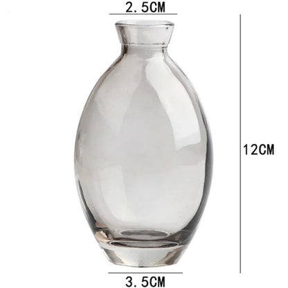 DecorBites™ mini glass flower vase with clear rounded body narrow neck and flat base for home decor