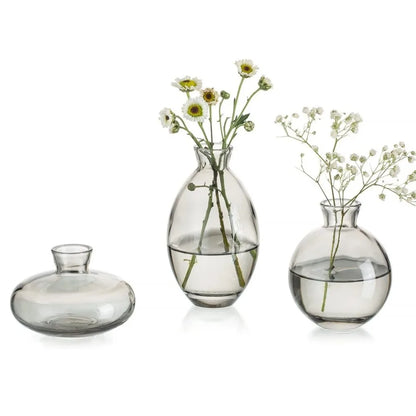 Set of three clear glass DecorBites™ mini flower vases with rounded minimalist design for home decor