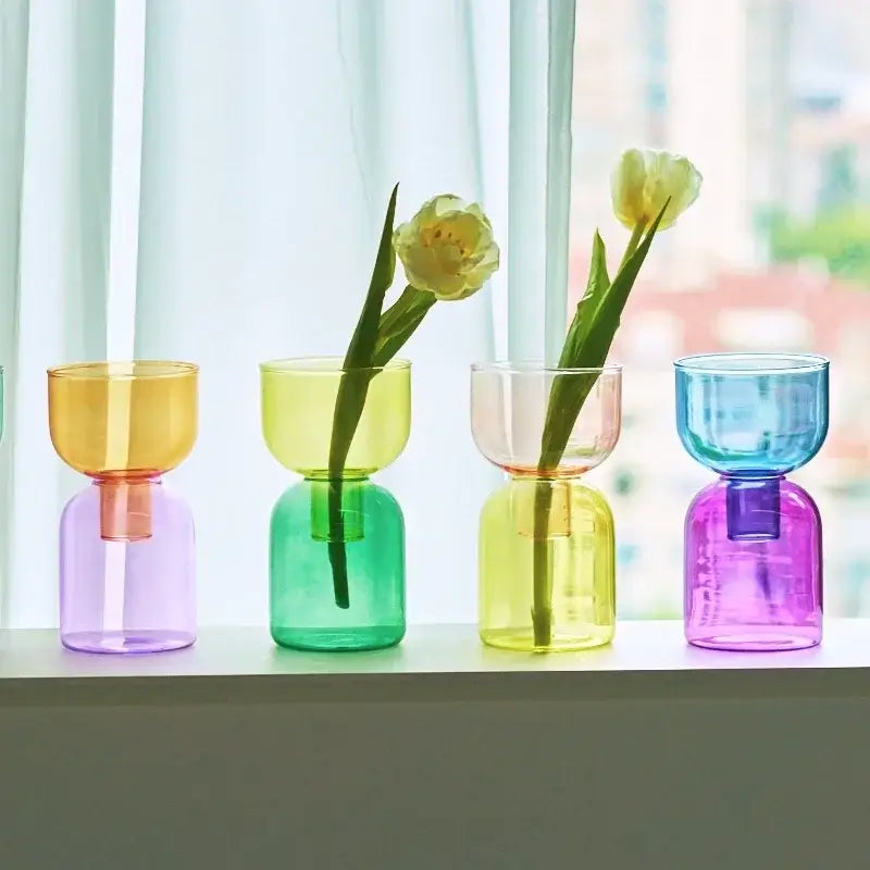 A set of four colorful two-toned glass vases from decorbites™ mini glass vase set for plants and candles