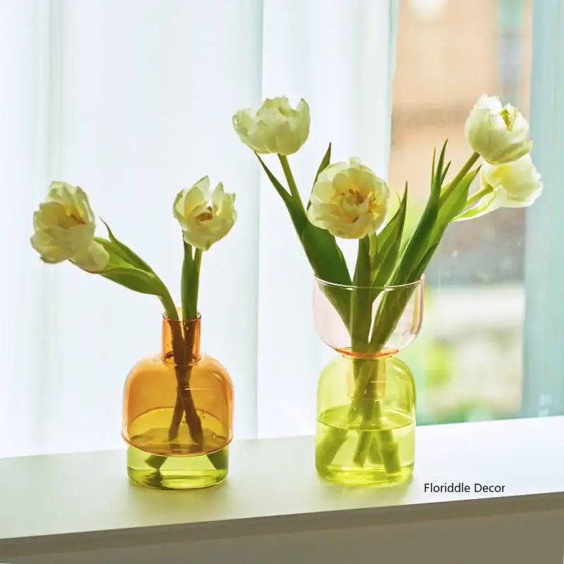 DecorBites™ glass vase set of two mini glass vases in amber and lime green with white tulips inside