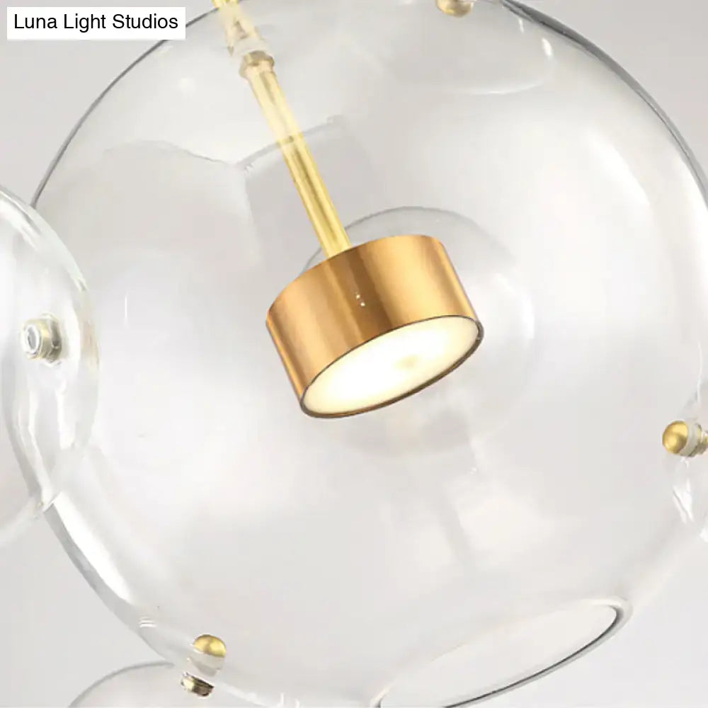 Decorbites minimal brass bubble pendant light with clear glass globe heads and brushed gold cylindrical housing in modern design