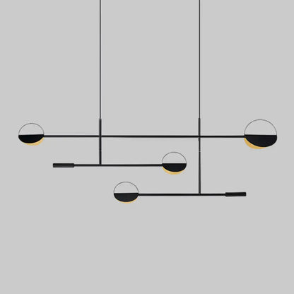 Modern black and gold geometric pendant light fixture with minimalist design for dining room by decorbites