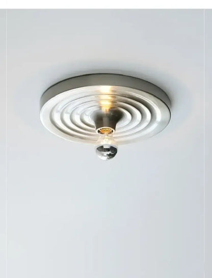 Modern brushed nickel decorbites bauhaus lamp with concentric rings and clear glass globe ceiling light fixture
